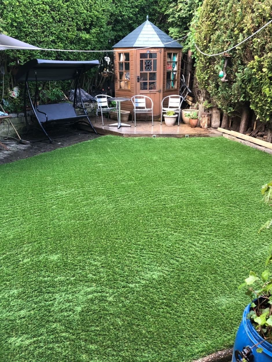 Completed landscaping project with defined planting and pathways