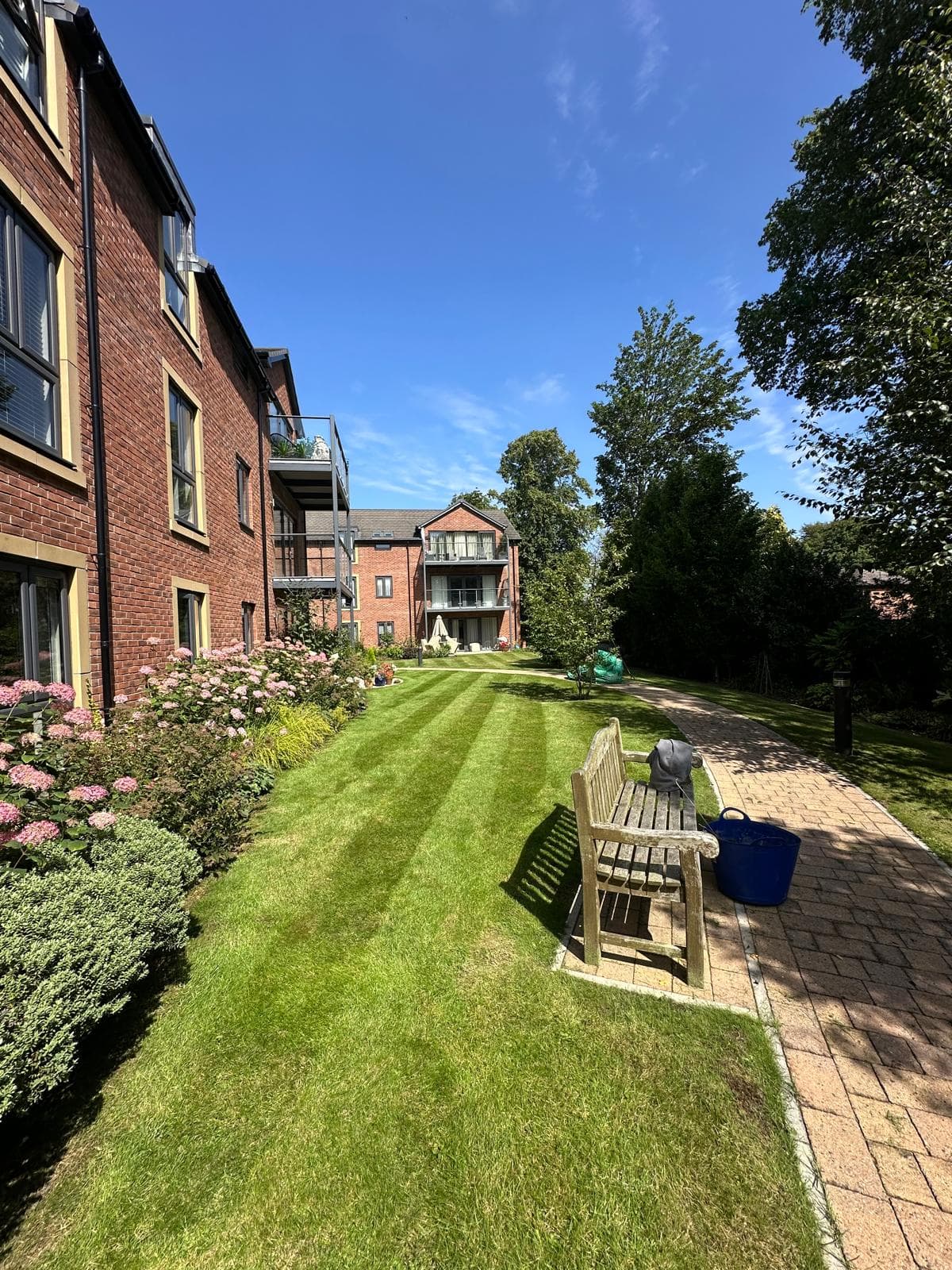 Grounds maintenance work on a landscaped outdoor area